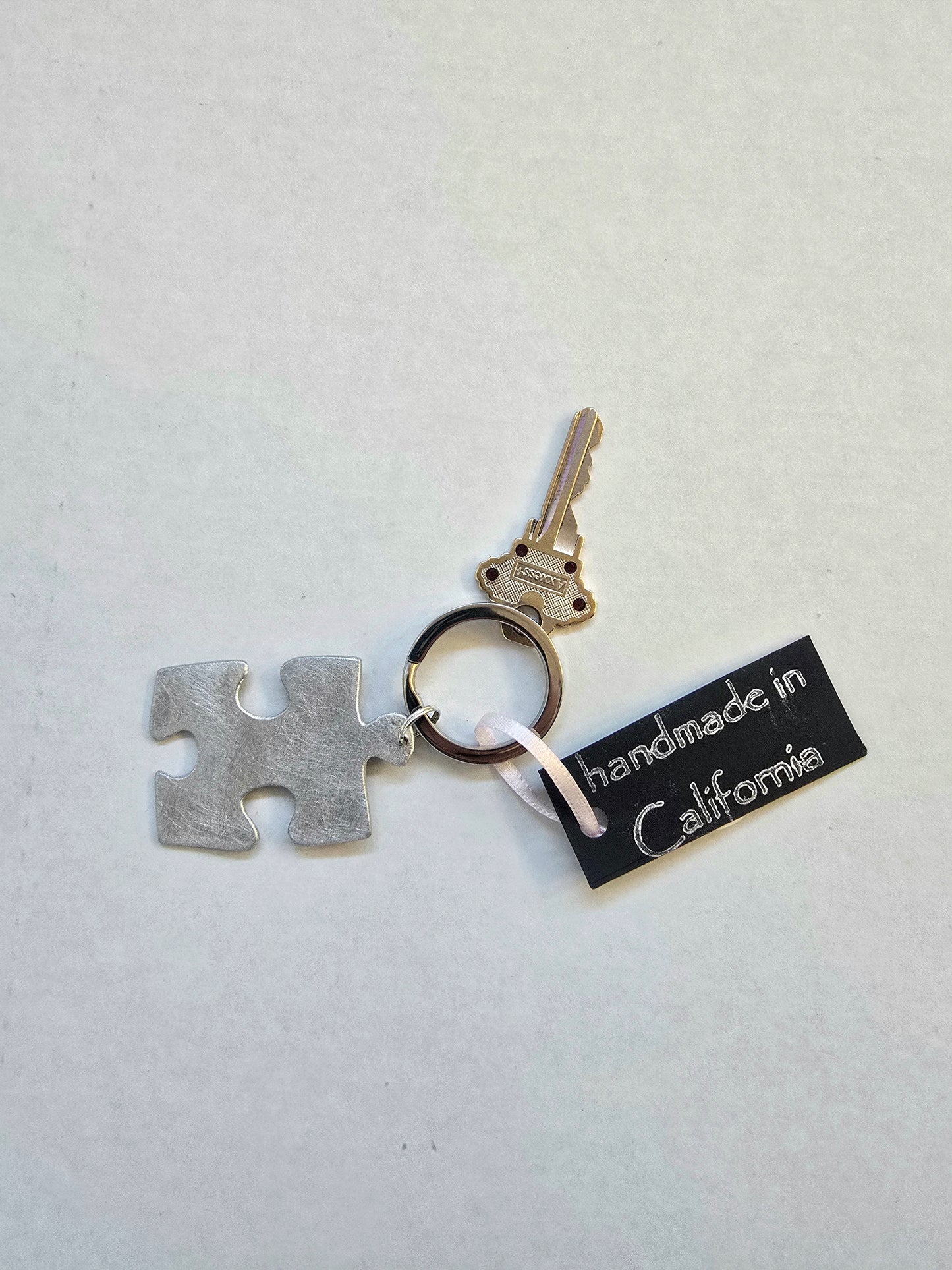 Puzzle Piece keychain handmade in California by Athena Craig