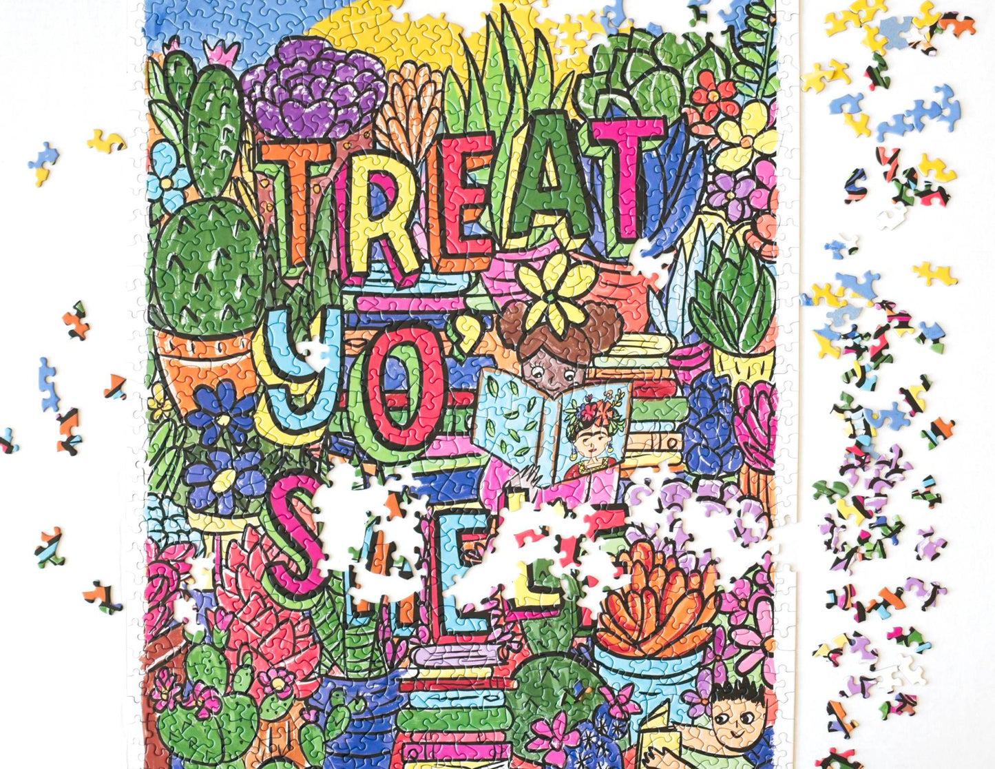 A nearly complete jigsaw puzzle with scattered pieces around the edges. A photo of a completed random-cut puzzle featuring a drawn image filled with colorful succulents and flowers and stacks of books. The words Treat Yo' Shelf are written in multi-colored block letters with shadows. In the center a child wearing pink reads a book with Frida Kahlo on he cover and another child wearing blue reads near the corner. At the top appears to be a blue sky and giant sun.