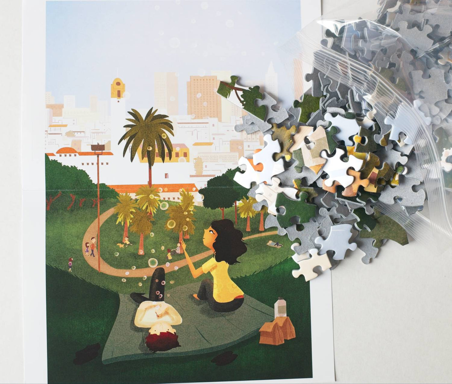 Puzzle pieces spilling onto an image of two people blowing bubbles in a park.