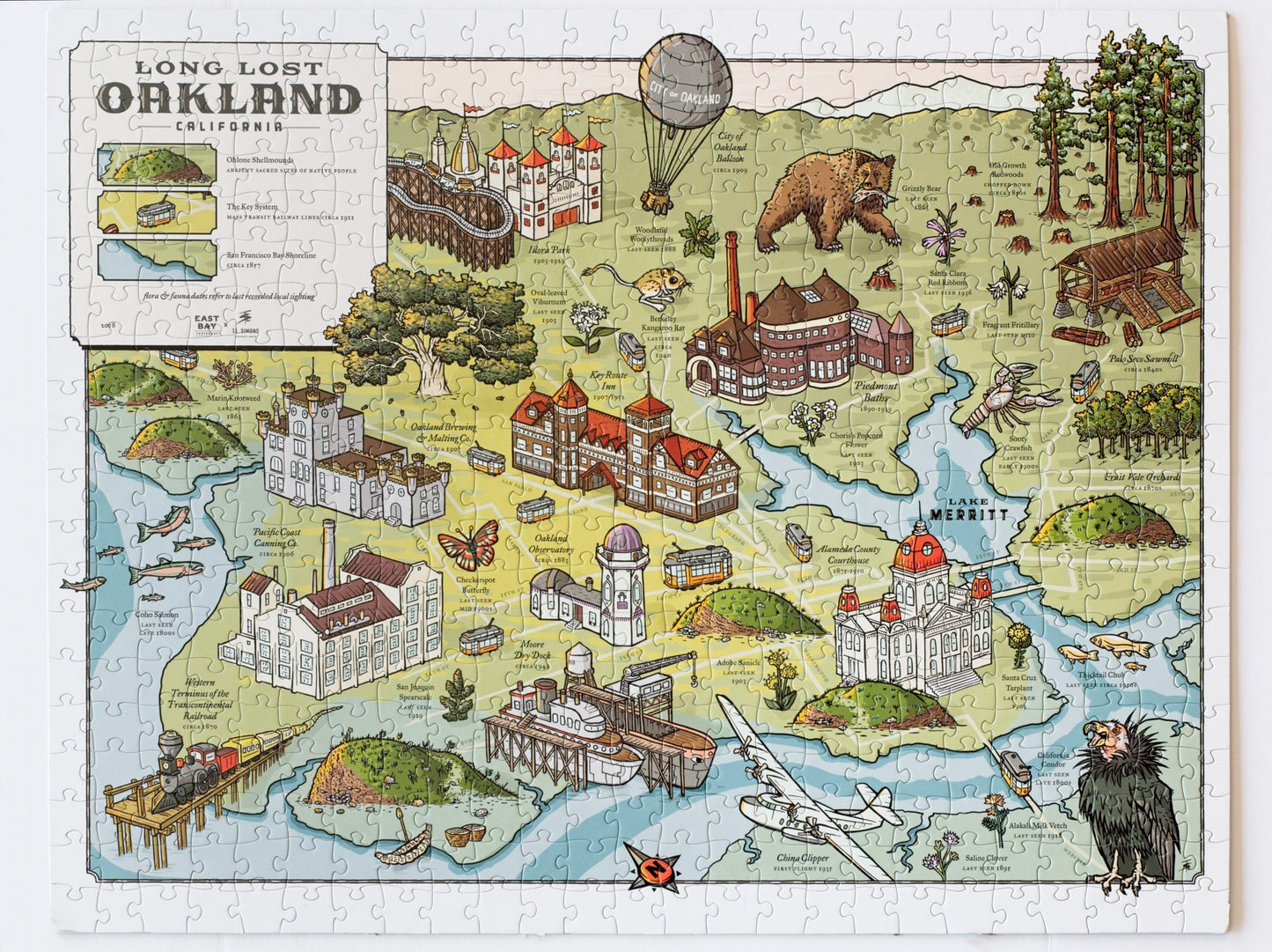 A completed jigsaw puzzle that shows an illustrated map of historical features of Oakland labeled Long Lost Oakland
