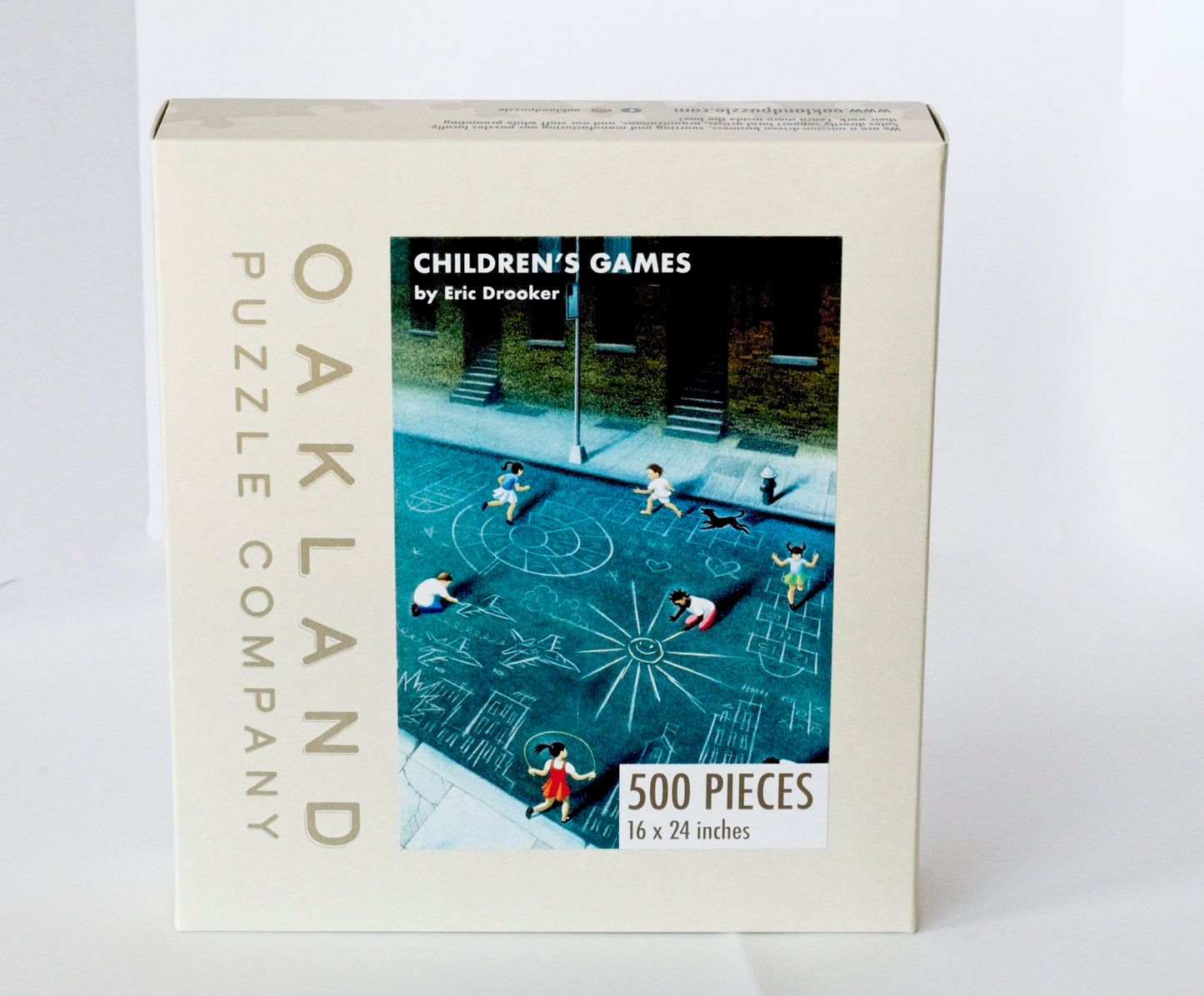 A box branded Oakland Puzzle Company featuring the Children's Games image on the front.