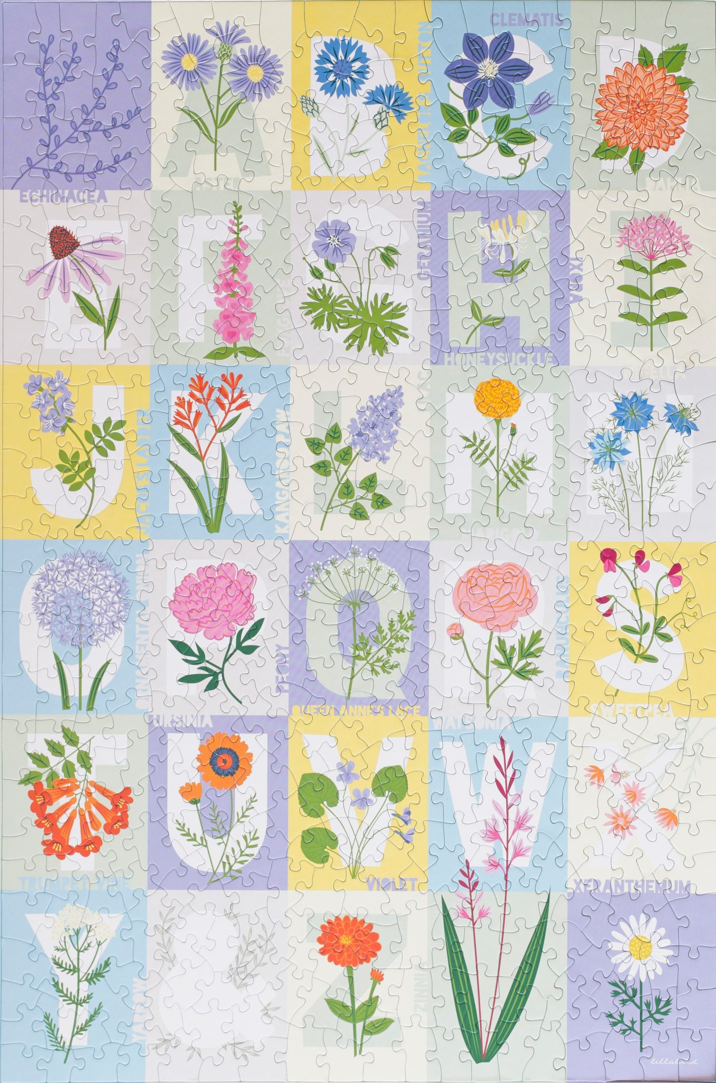 A completed puzzle showing grid of pastel colors with the letters a-z on most of the squares desgined with a flower corresponding to that letter.