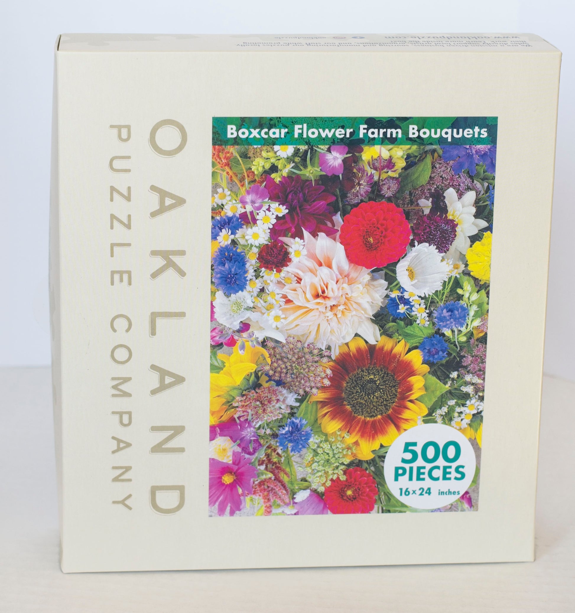 A box branded Oakland Puzzle Company featuring the Box Car Flower Farm Bouquets image on the front.