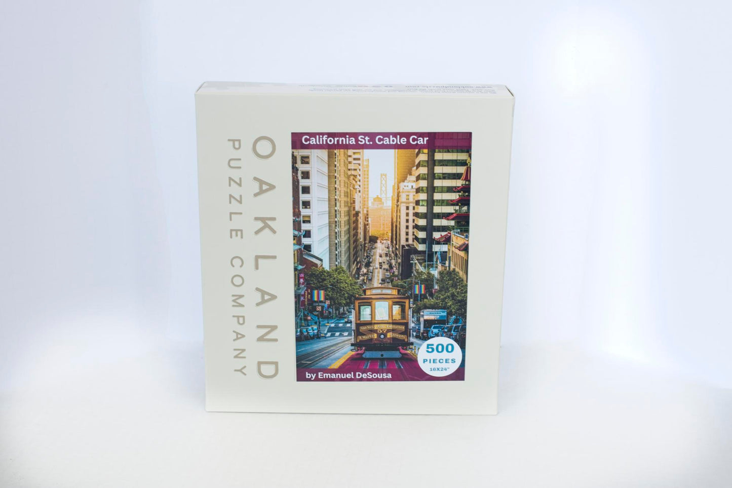 A box branded Oakland Puzzle Company with a California Street Cable Car image on the front