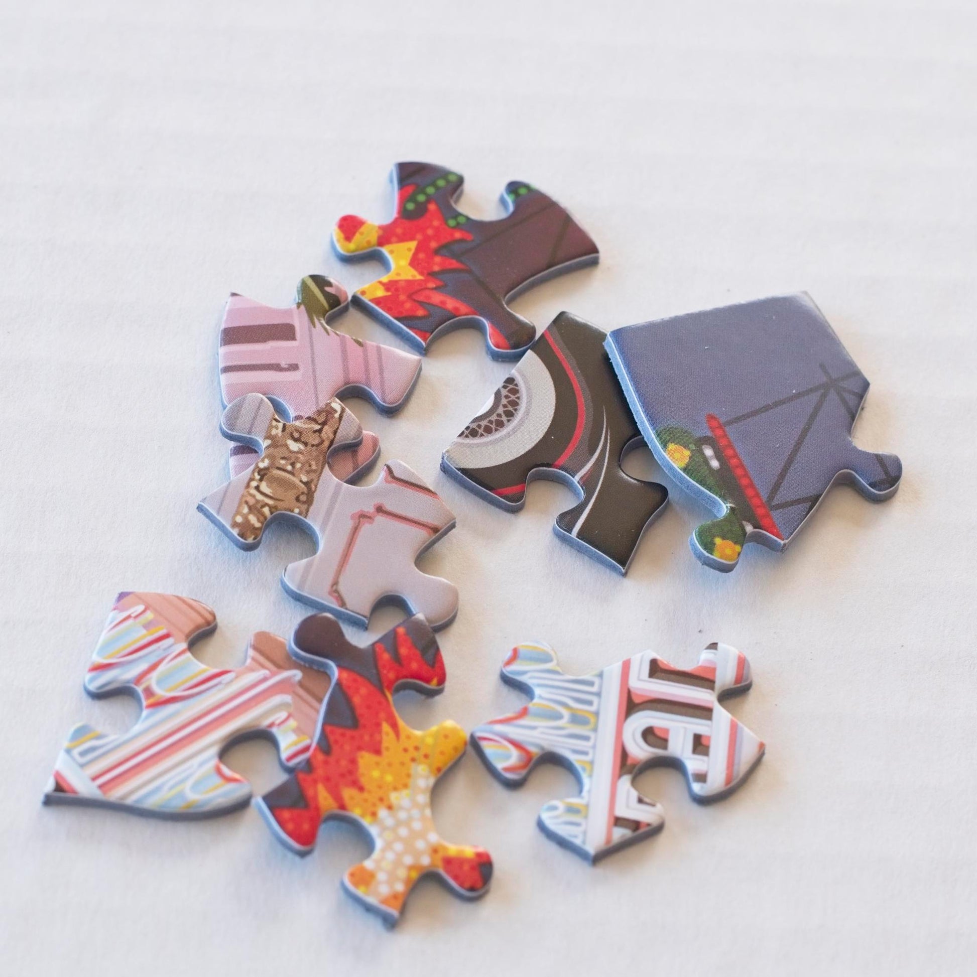 A close up of colorful random-cut puzzle pieces