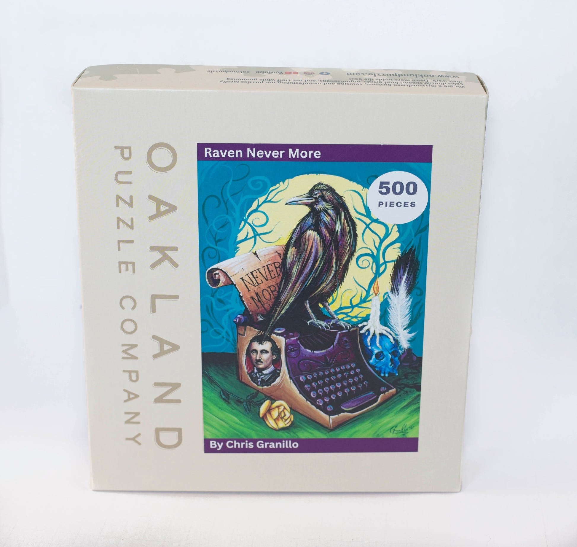 A box branded Oakland Puzzle Company featuring the Raven Never More image on the front