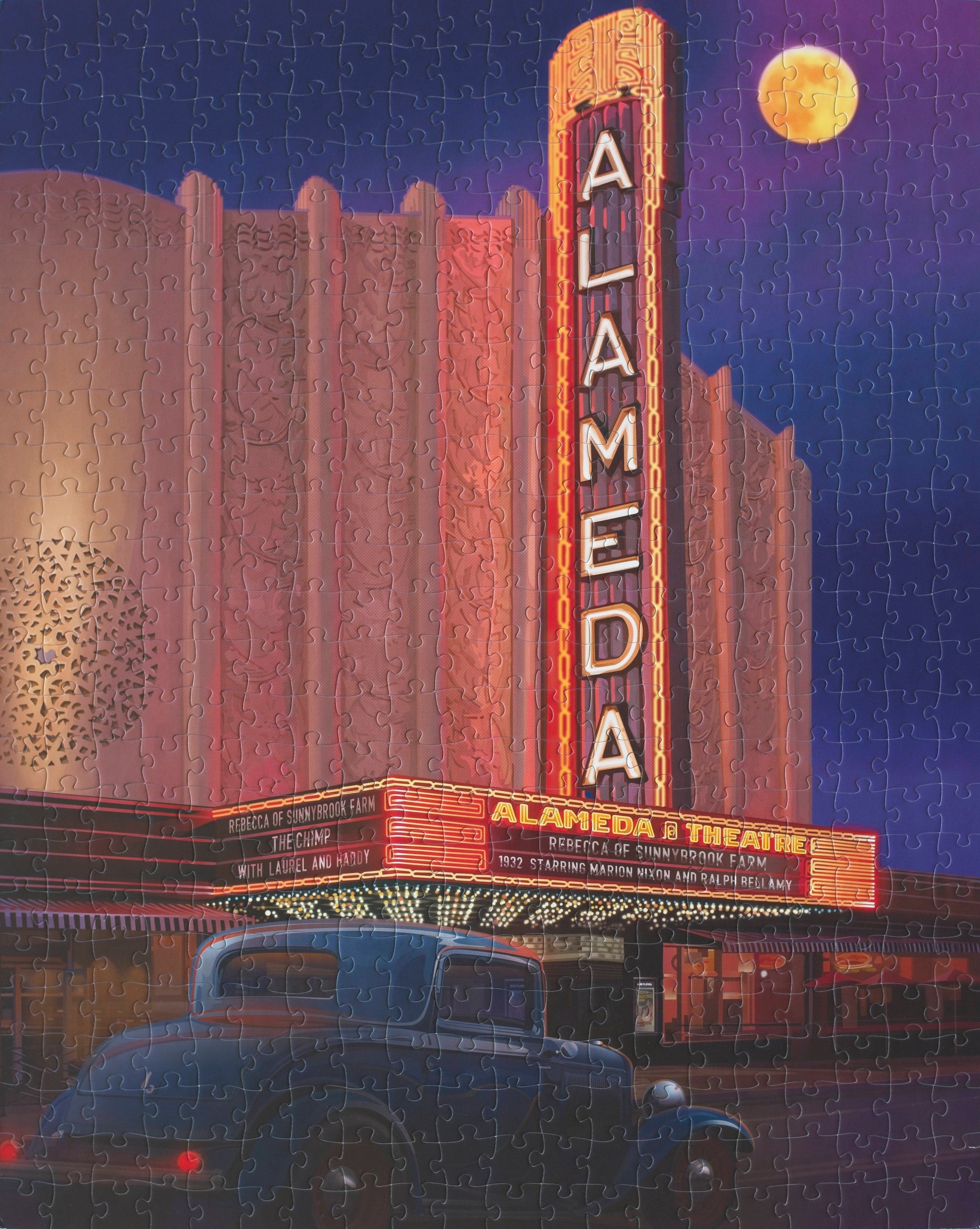 A completed illustrated Jigsaw puzzle featuring a classic car and an art deco theatre. It is night time, the moon is out and the theater sign is lit.