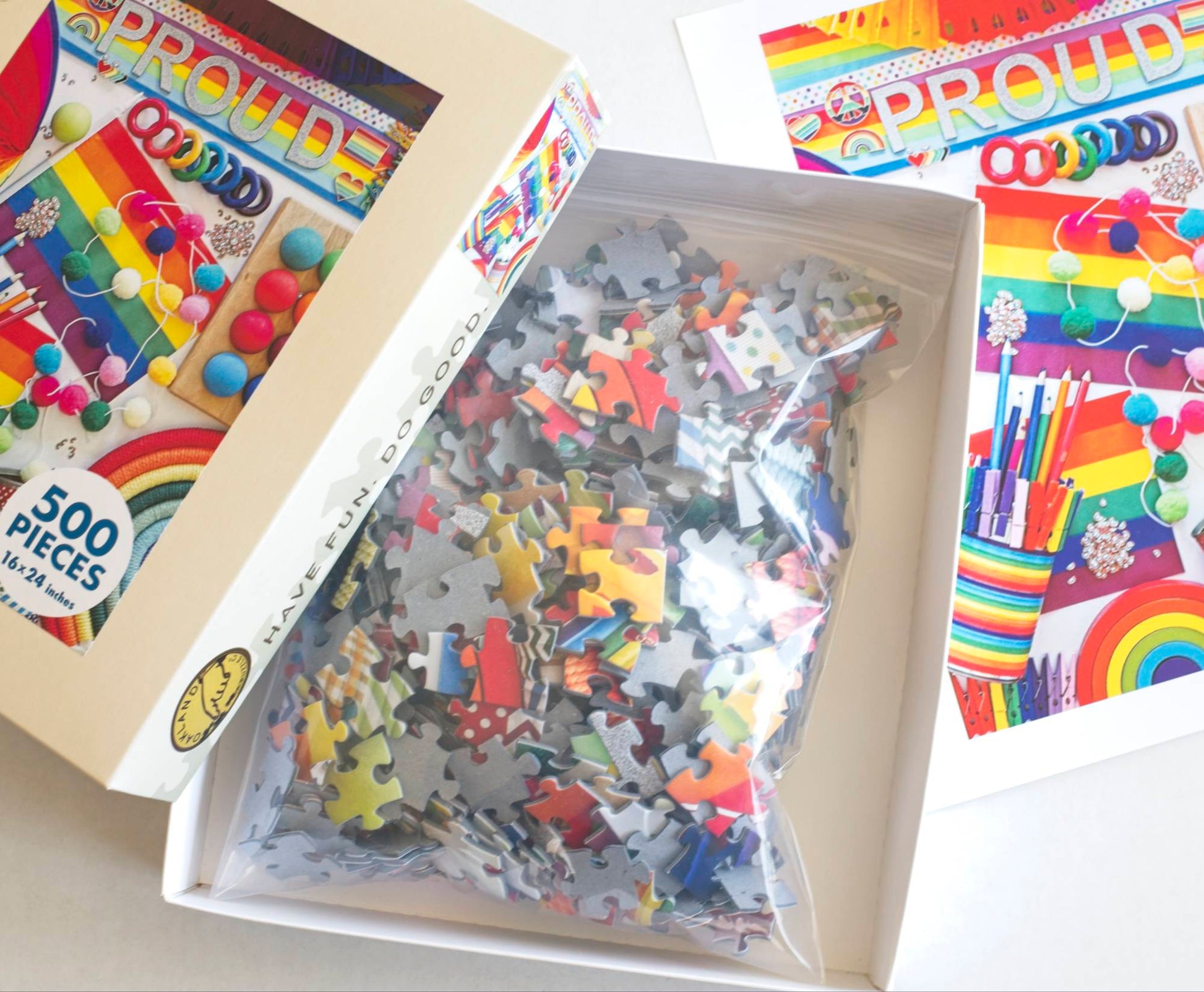 Puzzle with colorful pieces and packaging on a white background