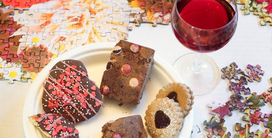 Oakland Puzzle Company puzzle with treats and wine