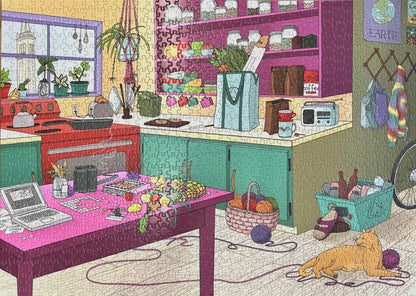 A completed jigsaw puzzle featuring a colorful kitchen scene with a cat, laptop, and various items on a table.