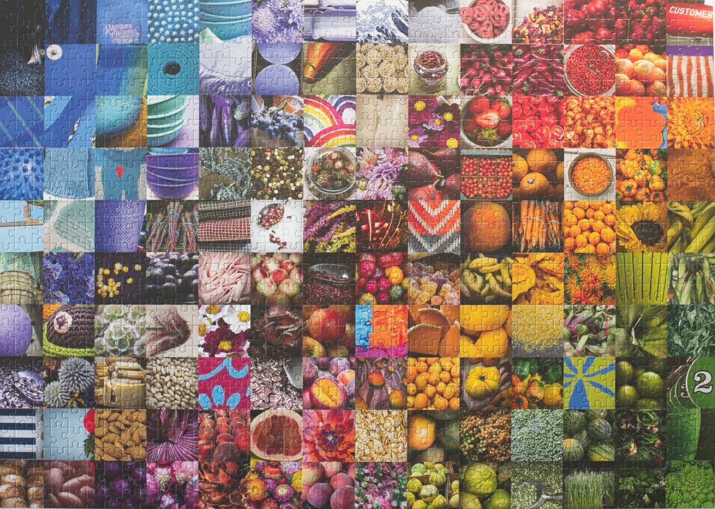 A photo of a completed traditionally cut jigsaw puzzle featuring a collage of 140 photos in a grid arranged roughly in a rainbow showing fruits, vegetables, flowers, textiles, and other goods commonly found in grocery stores.