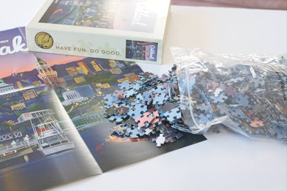 Puzzle with pieces and packaging on a table