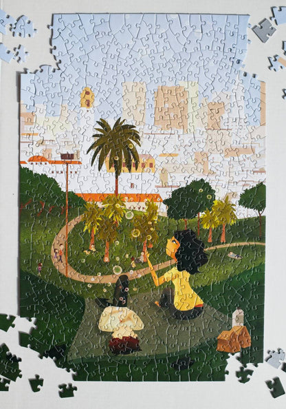 Jigsaw puzzle with a completed section showing a two people blowing bubbles on picnic in a park with palm trees and the San Francisco skyline in the background.