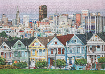 A completed jigsaw puzzle featuring the iconic and colorful Painted Ladies victorian homes with the San Francisco city skyline in the background