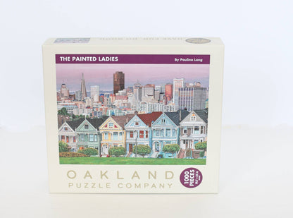 Jigsaw puzzle box featuring 'The Painted Ladies' by Oakland Puzzle Company on a white background