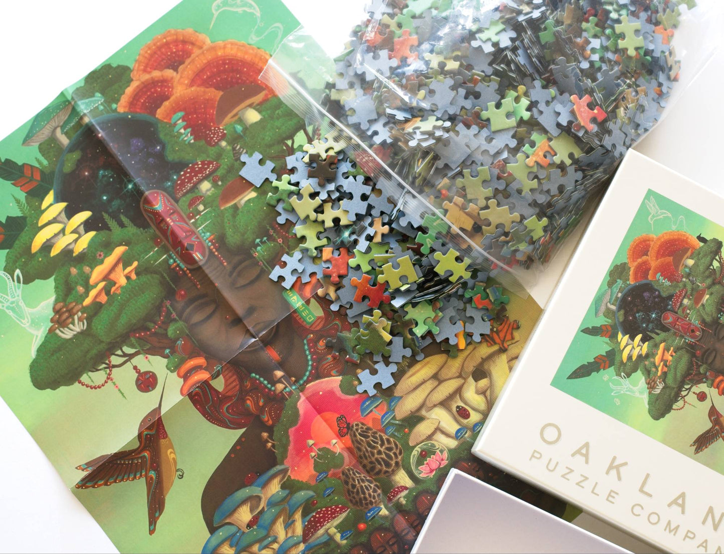 Jigsaw puzzle pieces spilling onto a colorful reference image featuring an African figure with many natural elements with packaging