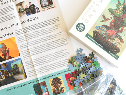 Jigsaw puzzle packaging with a puzzle pieces with blue backed board and promotional material.