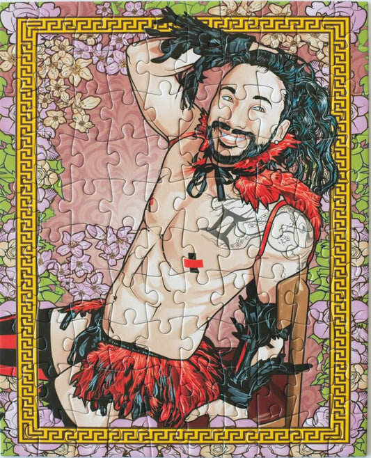 A completed jigsaw puzzle featuring a stylized illustrated portrait of a smiling bearded man with long dark hair, red feathered collar and shorts, set against a floral background with a decorative gold border.