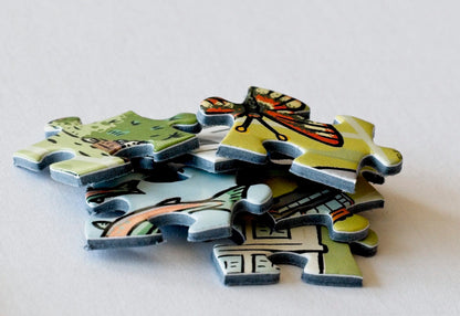 A close-up shot of colorfully illustrated puzzle pieces in a pile