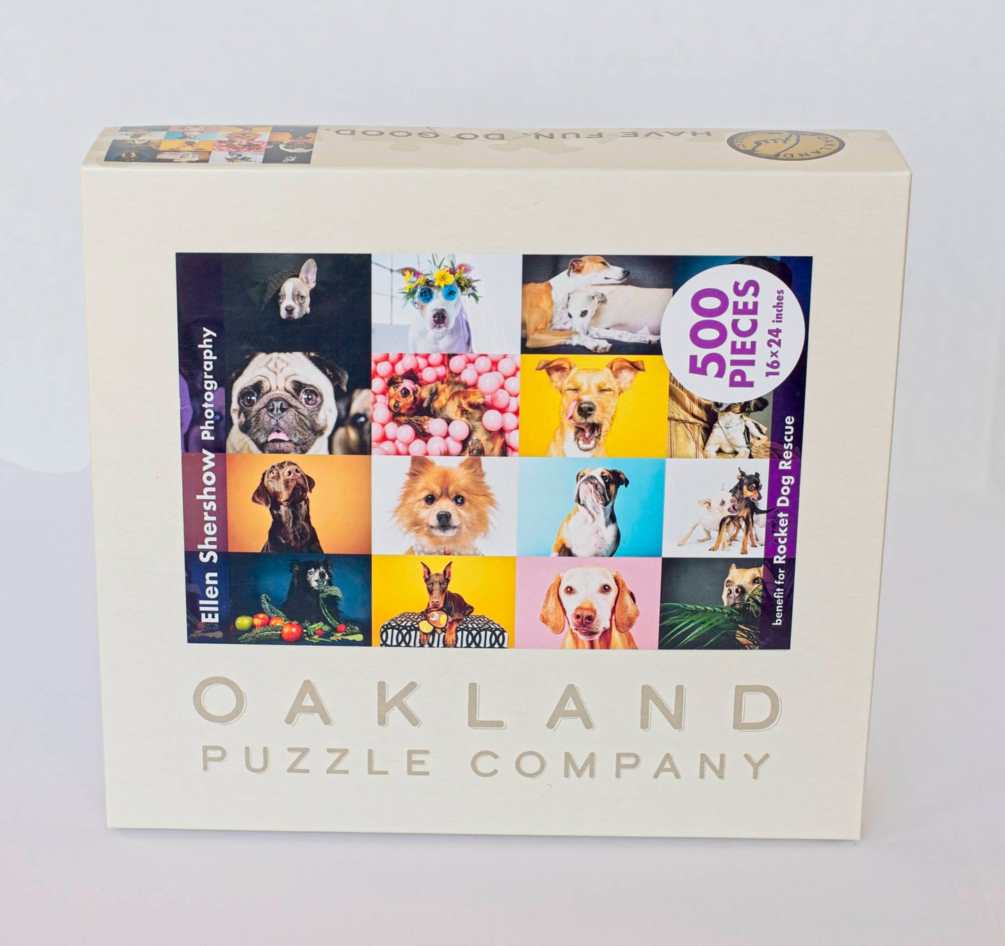 A box labeled "Oakland Puzzle Company" featuring a colorful image of a 4x4 grid of dog photos.