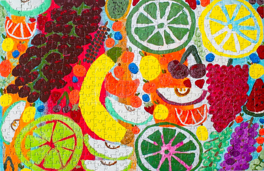 A colorful  jigsaw puzzle with a variety of fruit artistically rendered