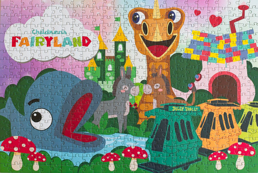 A completed illustrated jigsaw puzzle that has the Children's Fairyland logo and a variety of features from the park, such as Willy the Whale, a dragon, two donkeys, and the jolly trolly.