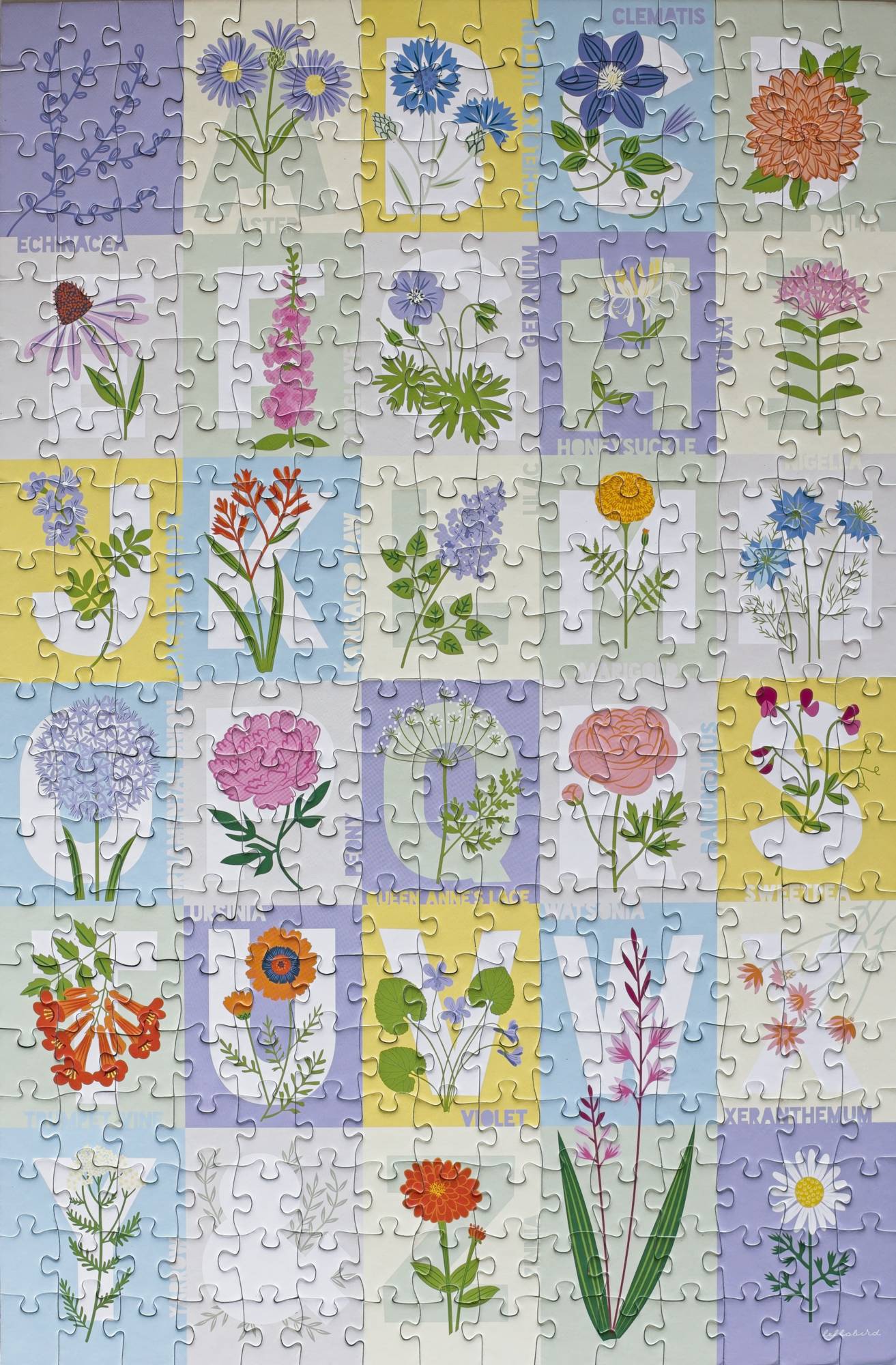 A completed jigsaw puzzle showing a designed quilted pattern with pastel colors. Each square has a letter A-Z with a flower with a name that starts with the corresponding letter