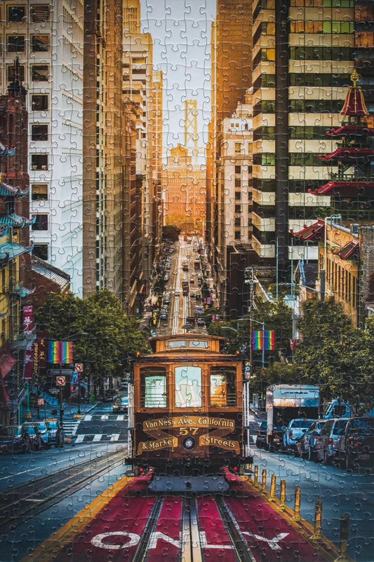 Completed San Francisco cable car jigsaw puzzle showing a cable car on California Street with the Bay Bridge and sunrise in the background