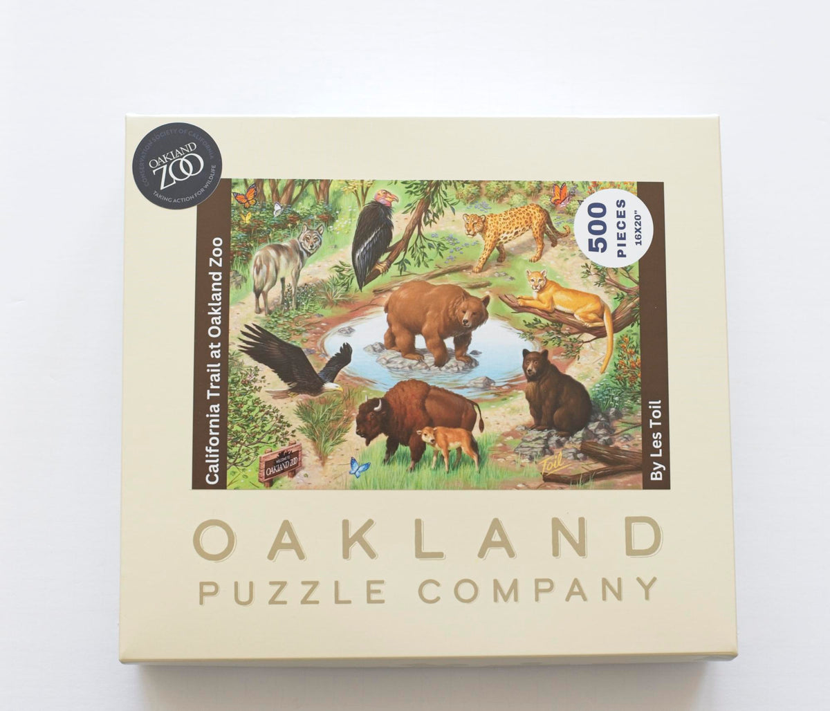 A product box featuring the Oakland Zoo image of native California animals with Oakland Puzzle Company branding