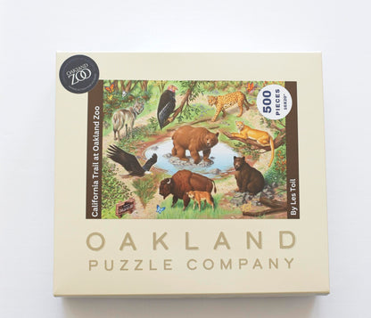A product box featuring the Oakland Zoo image of native California animals with Oakland Puzzle Company branding