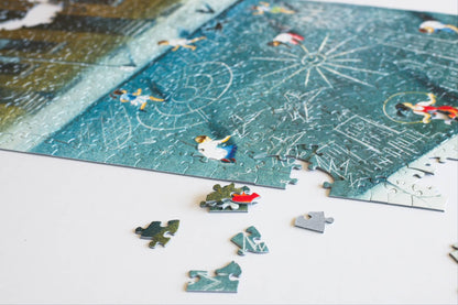 A stack and a scattering of puzzle pieces next to a partially completed jigsaw puzzle. 