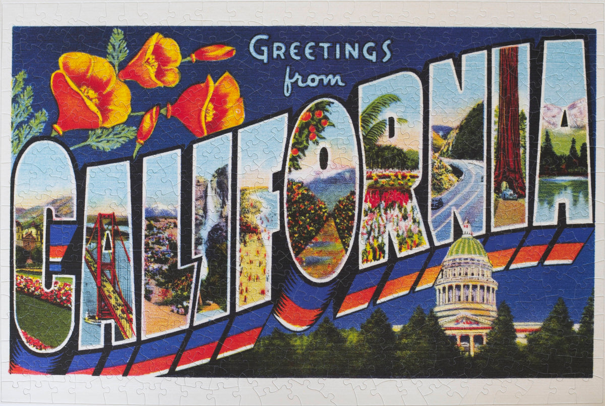 A completed jigsaw puzzle featuring a vintage postcard that says Greetings from California. The letters in California feature different natural and man-made features in the state and the Capitol building is below. 
