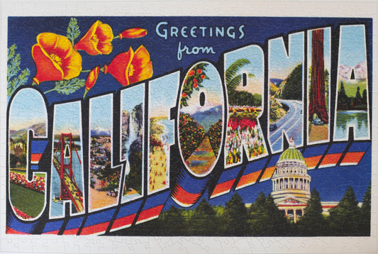 A completed jigsaw puzzle featuring a vintage postcard that says Greetings from California. The letters in California feature different natural and man-made features in the state and the Capitol building is below. 