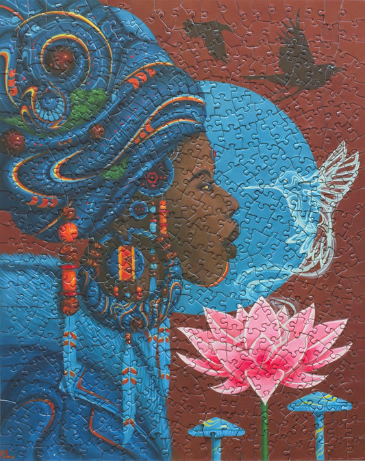 A completed jigsaw puzzle showing a Caribbean woman's face from the side nose to nose with a hummingbird. She wears blue clothes and her chin is near a lotus flower. 
