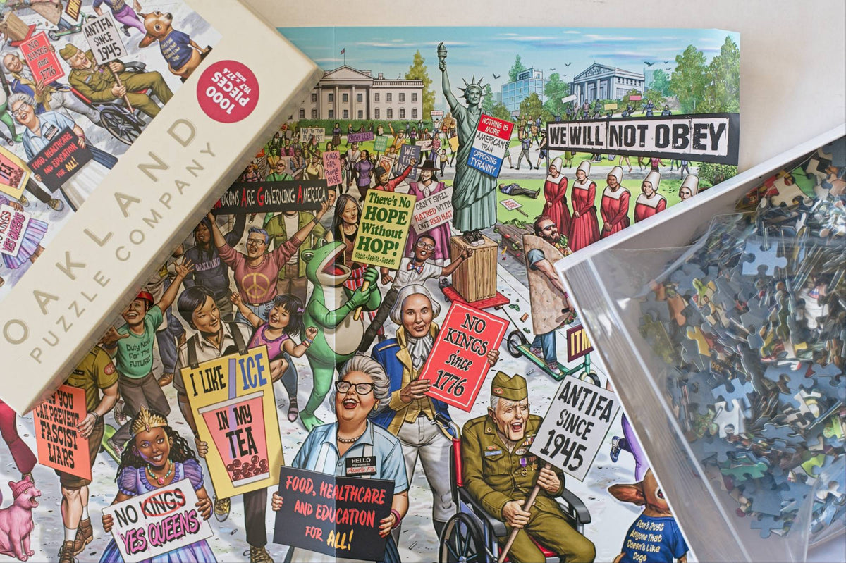 An open puzzle box revealing a resealable plastic bag with colorful puzzle pieces over a reference image