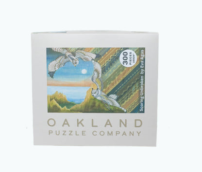 Oakland Puzzle Company puzzle box with bird illustration and '300 Pieces' text on a white background