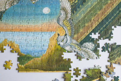 A partially completed colorful earth-toned jigsaw puzzle with an owl design on a white background.