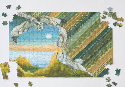 Jigsaw puzzle close to completion showing a landscape with birds and geometric patterns.
